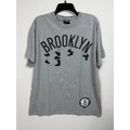 UNK NBA Brooklyn Nets Mens XL Gray Graphic T-Shirt Hanging Sneakers Logo Cotton