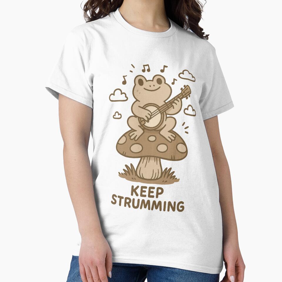 Keep Strumming – Cute Frog Playing Banjo on Mushroom Illustration by inkoutninja