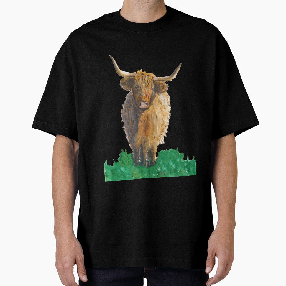 Fluffy highland cow in field by Sam Hill