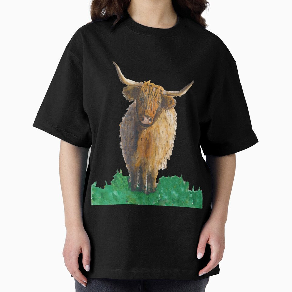 Fluffy highland cow in field by Sam Hill