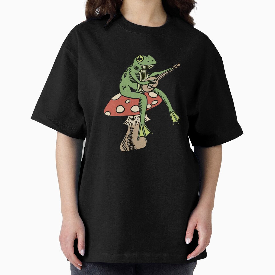 frog sitting on a mushroom playing guitar by moonna designs