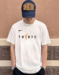 Miami Heat player wearing Thirty WNBA logo shirt