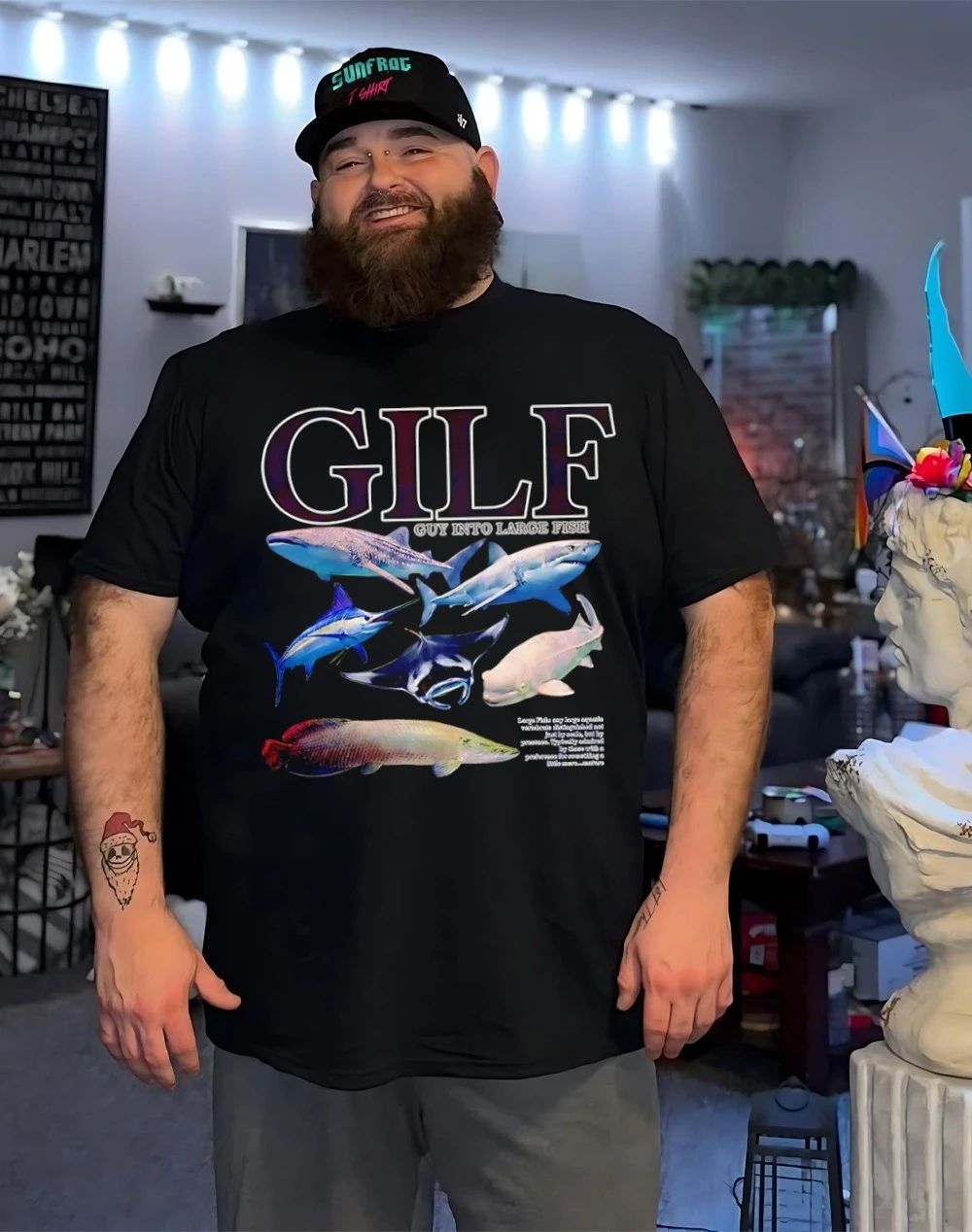 GILF guy into large fish shirt