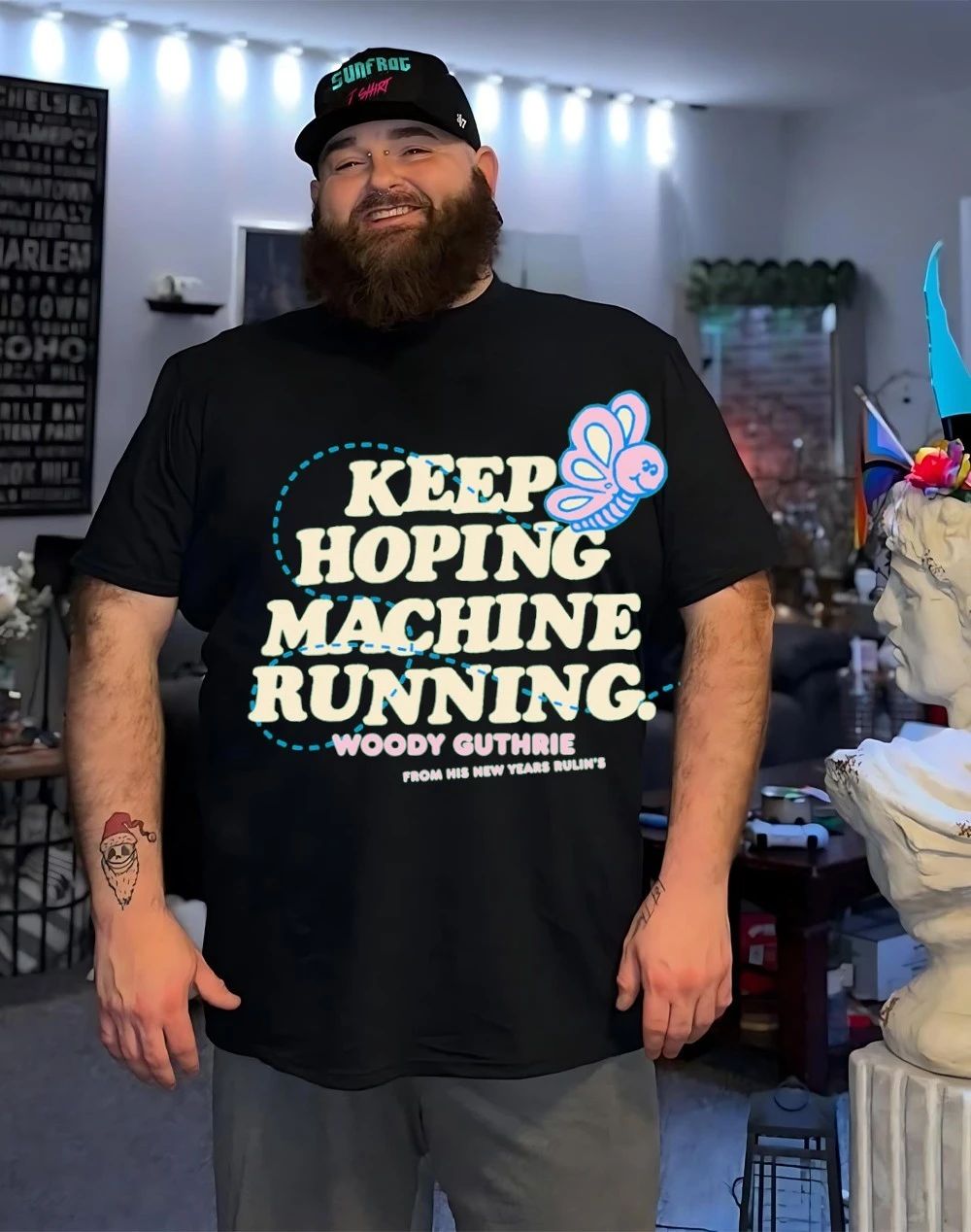 Woody Guthrie keep hoping machine running from his new years rulin’s shirt