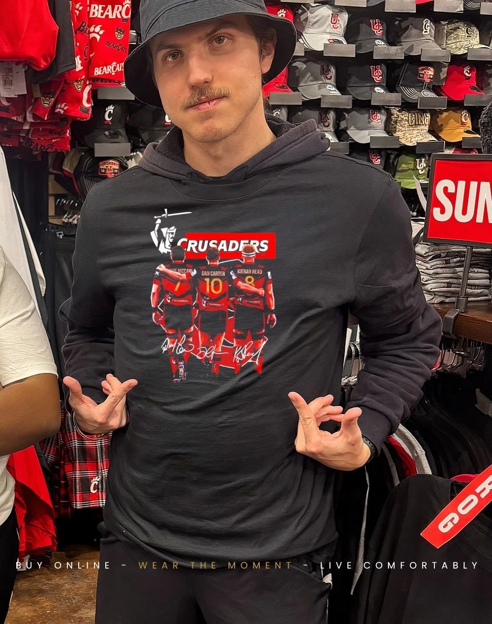 Crusaders Rugby Union players behind signatures shirt