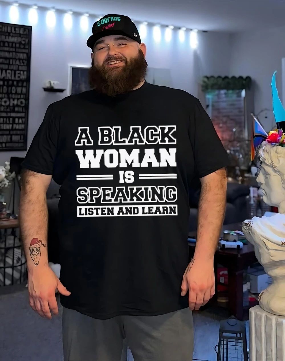 A black woman is speaking listen and learn shirt